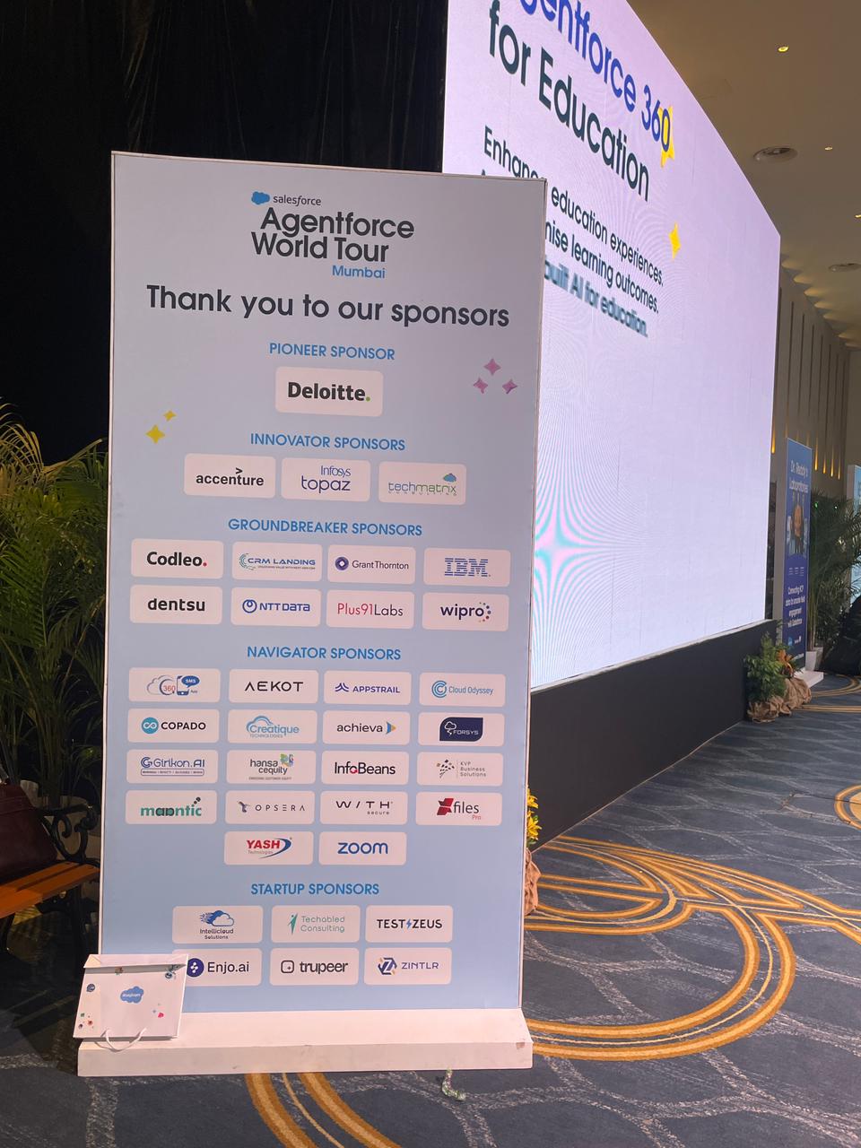 Agentforce World Tour Mumbai 2026 sponsor wall, including KVP Business Solutions