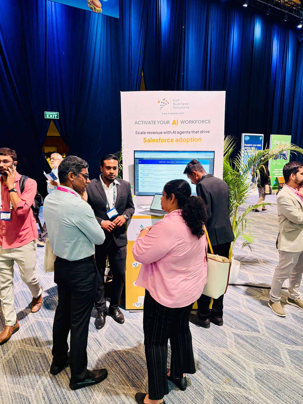 Customers reviewing KVP Salesforce accelerators at the booth